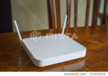 Modern White Wireless Router for Internet Connection on Wooden Table Surface Modern White Wireless Router for Internet Connection on Wooden Table Surface 124548026