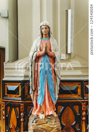 Virgin Mary statue in Christian Catholic church. Religion, Christianity, Catholicism concept 124548084