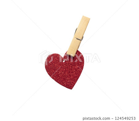 Paper heart with glitter hanging with a clothespin. Heart isolated on white background 124549253