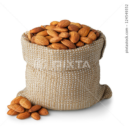 Almond nuts in burlap bag and pile isolated on white background Almond nuts in burlap bag and pile isolated on white background 124549352