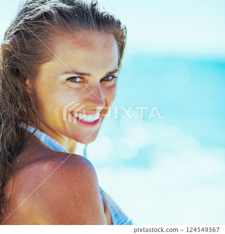 smiling young woman on beach smiling young woman on beach 124549367