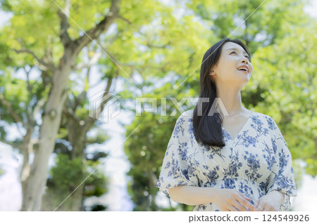 A woman relaxing in the park A woman relaxing in the park 124549926