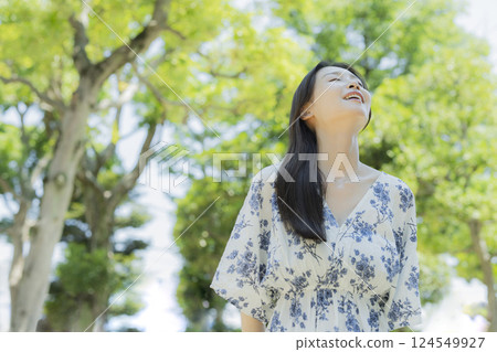 A woman relaxing in the park A woman relaxing in the park 124549927