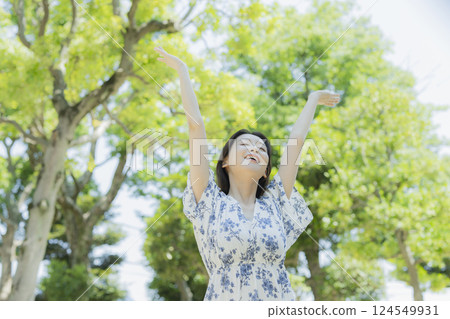 A woman relaxing in the park A woman relaxing in the park 124549931