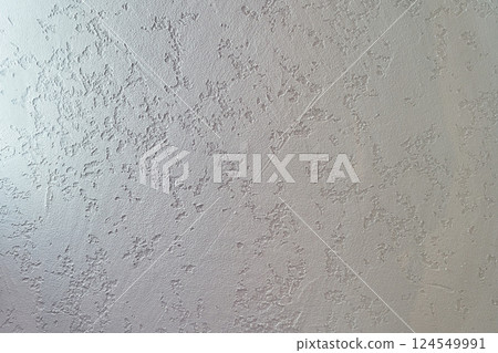 Uneven background with the texture of decorative plaster painted in white concrete wall. Rough wall with space for copying. High quality photo 124549991