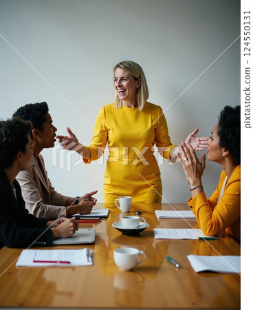 Female leader engaging team in business meeting with positive interaction 124550131
