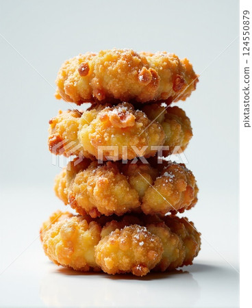 Delicious stack of crunchy fried donuts perfect for dessert or snack inspiration 124550879