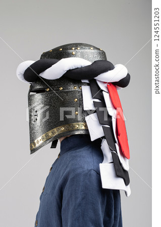 Medieval Knight Helmet with White and Black Drapery Medieval Knight Helmet with White and Black Drapery 124551203