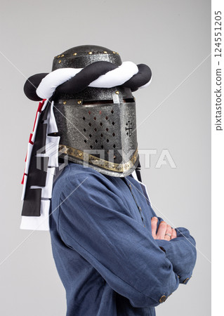 Medieval Knight Helmet with White and Black Drapery Medieval Knight Helmet with White and Black Drapery 124551205