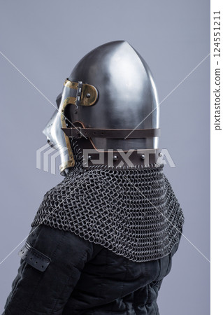 Side View of a Medieval Bascinet Helmet with Hounskull Visor 124551211