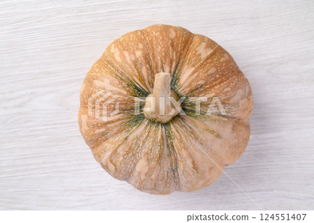 Organic Asian pumpkin on white background, Top view Organic Asian pumpkin on white background, Top view 124551407
