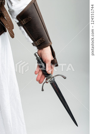 Hand holding a Colichemarde Dagger Hand holding a Colichemarde Dagger 124551744