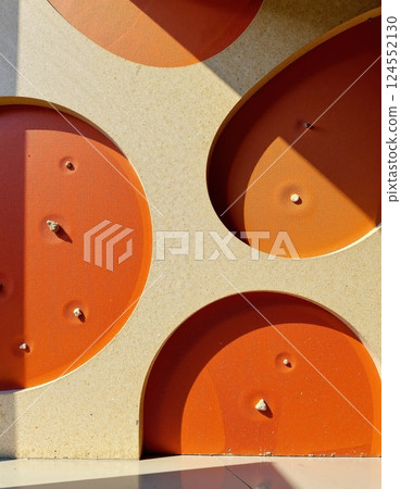 Abstract geometric design with textured orange circles and shadows for modern interior art 124552130