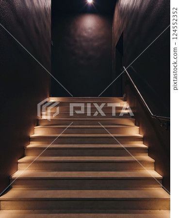 Modern interior design featuring illuminated staircase with minimalist lighting 124552352