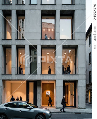 Modern urban building facade with glass windows and pedestrian street activity 124552370