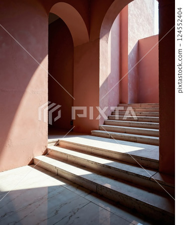 Sunlit architectural staircase with arched openings in minimalist design 124552404