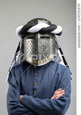 Medieval Knight Helmet with White and Black Drapery Medieval Knight Helmet with White and Black Drapery 124552479