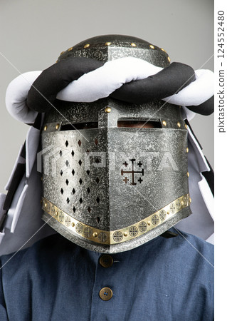 Medieval Knight Helmet with White and Black Drapery 124552480