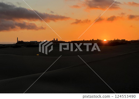 A colorful sunset at a Maspalomas dune, Gran Canaria island A colorful sunset at a Maspalomas dune, Gran Canaria island 124553490