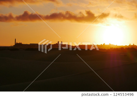A colorful sunset at a Maspalomas dune, Gran Canaria island A colorful sunset at a Maspalomas dune, Gran Canaria island 124553496