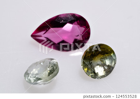 Close-Up of Polished Multicolored Tourmaline Gemstones in Pear and Oval Shapes 124553528
