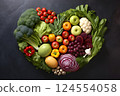 Heart shape made of fresh vegetables on dark background. Healthy food concept. top view 124554058