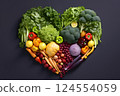 Heart shape made of fresh vegetables on dark background. Healthy food concept. top view 124554059