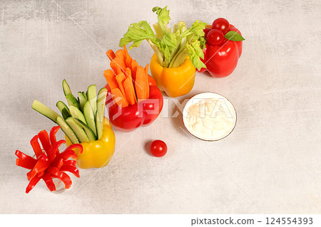 Vegetable sticks in bell peppers and sauce for weight loss, intermittent fasting. Raw food concept and diet food, Healthy breakfast with ingredients, menu for cafe or restaurant, kitchen background, 124554393