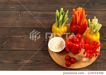 Raw food concept and diet food, Vegetable sticks in bell peppers and sauce for weight loss, intermittent fasting. Healthy breakfast with ingredients, menu for cafe or restaurant, kitchen background, 124554398