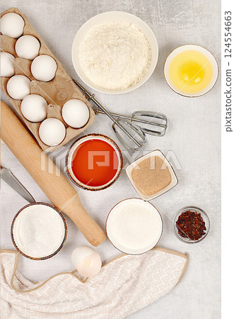 Kitchen background of food preparation.Culinary ingredients for making pie and bread,recipe with eggs,flour,sugar,honey,cinnamon,yeast and butter.Concept of modern bakery, Kitchen background of food preparation.Culinary ingredients for making pie and bread,recipe with eggs,flour,sugar,honey,cinnamon,yeast and butter.Concept of modern bakery, 124554663