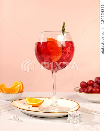 Royal lemonade cocktail with tequila, gin, rum, ice and grapes, bar and party concept, restaurant and cafe advertising card, elegant minimal background, selective focus 124554851