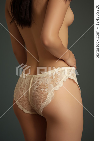 Elegant display of lace lingerie focusing on beauty and sensuality. Perfect feminine body. Stylish presentation of lace undergarments, elegance, fashion, and beauty. Objectification 124555220