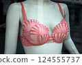 Closeup of pink bra on mannequin in a fashion store showroom 124555737