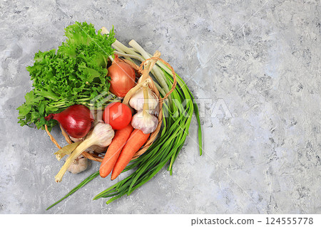 Healthy balanced diet with dietary ingredients, vegetables in basket for weight loss, source of vitamin C, concept of healthy lifestyle and detox diet, advertising for store and cafe, selective focus Healthy balanced diet with dietary ingredients, vegetables in basket for weight loss, source of vitamin C, concept of healthy lifestyle and detox diet, advertising for store and cafe, selective focus 124555778
