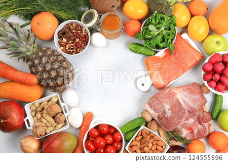 Healthy balanced food with dietary ingredients, vegetables, fruits, nuts, meat, fish for weight loss, healthy lifestyle concept, place for text, selective focus Healthy balanced food with dietary ingredients, vegetables, fruits, nuts, meat, fish for weight loss, healthy lifestyle concept, place for text, selective focus 124555896