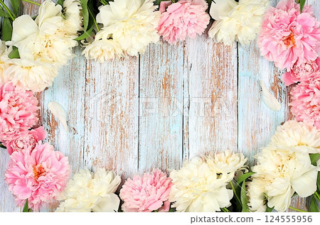 Frame of delicate beautiful flowers of peonies, roses on a sunny table. Spring still life and banner for the screen, elegant concept of beauty, template for design. Abstract flower arrangement Frame of delicate beautiful flowers of peonies, roses on a sunny table. Spring still life and banner for the screen, elegant concept of beauty, template for design. Abstract flower arrangement 124555956