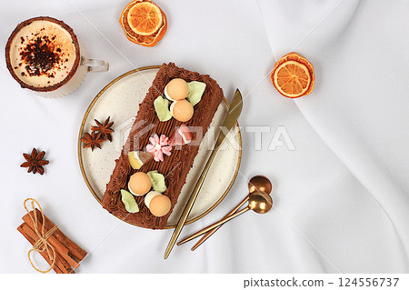 Homemade delicious tiramisu, sponge cake or cake with sweet jam, cream, nuts, cinnamon and milk drink eggnog with cocoa. Concept of modern bakery, festive treat and advertising for cafe and Homemade delicious tiramisu, sponge cake or cake with sweet jam, cream, nuts, cinnamon and milk drink eggnog with cocoa. Concept of modern bakery, festive treat and advertising for cafe and 124556737