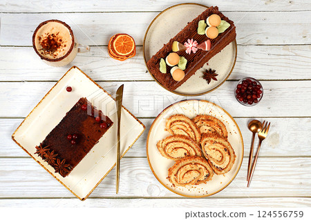Homemade dessert, stollen or strudel with sweet cream filling, nuts, cinnamon and eggnog. Concept for holiday bakery, seasonal treats and cafe advertising, selective focus 124556759