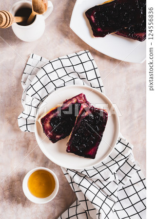 Delicious upside down berry pies on a plate on the table top and vertical view Delicious upside down berry pies on a plate on the table top and vertical view 124556836
