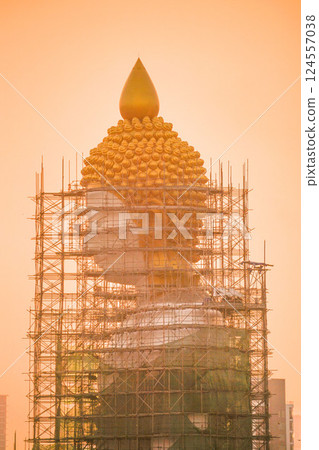 Giant Buddha statue at Wat Paknam temple in Bangkok, Thailand, undergoing repairs Giant Buddha statue at Wat Paknam temple in Bangkok, Thailand, undergoing repairs 124557038