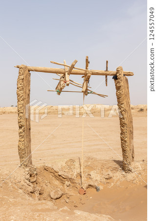 Wooden structure of an old water well. Western Sahara. Morocco.. Wooden structure of an old water well. Western Sahara. Morocco.. 124557049