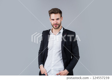 he got great style. Portrait of a handsome CEO. Businessman in suit. Young handsome man. Young manager in his office. portrait of a businessman on grey background. confident businessman portrait 124557239