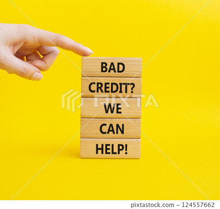 Bad credit We can Help symbol. Wooden blocks with words Bad credit We can Help. Businessman hand. Beautiful yellow background. Business and Bad credit We can Help concept. Copy space. Bad credit We can Help symbol. Wooden blocks with words Bad credit We can Help. Businessman hand. Beautiful yellow background. Business and Bad credit We can Help concept. Copy space. 124557662