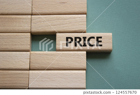 Price symbol. Concept word Price on wooden blocks. Beautiful grey green background. Business and Price concept. Copy space. Price symbol. Concept word Price on wooden blocks. Beautiful grey green background. Business and Price concept. Copy space. 124557670