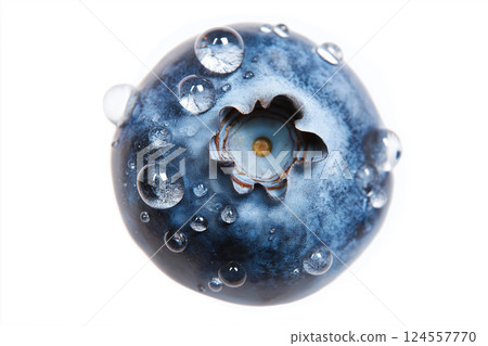Close-up of a fresh blueberry covered in water droplets on white background. Macro shot of a single fresh blueberry adorned with water droplets isolated. Summer, vitamins, healthy eating theme 124557770