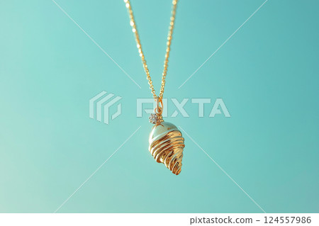 Elegant golden ice cream cone necklace on a light blue background. White gold ice cream cone jewelry pendant. Sweets and fast fashion concept. Rip diet, creative jewelry. Summer vibes, holidays. 124557986