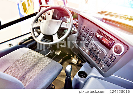 Driver seat and steering wheel with dashboard of bus 124558016