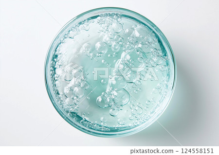 Transparent gel with bubbles creating a fresh and soothing texture. A close-up of transparent gel with bubbles evoking clarity and calmness. Gel smears. Beauty, cosmetics concept 124558151