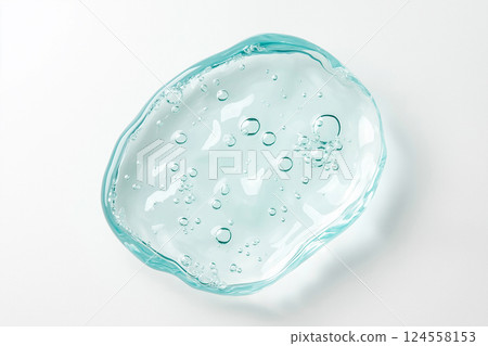 Transparent gel with bubbles creating a fresh and soothing texture. A close-up of transparent gel with bubbles evoking clarity and calmness. Gel smears. Beauty, cosmetics concept 124558153