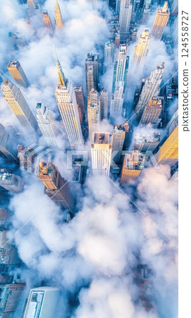 City skyline emerges from dense clouds in natural daylight with a serene ambiance 124558727